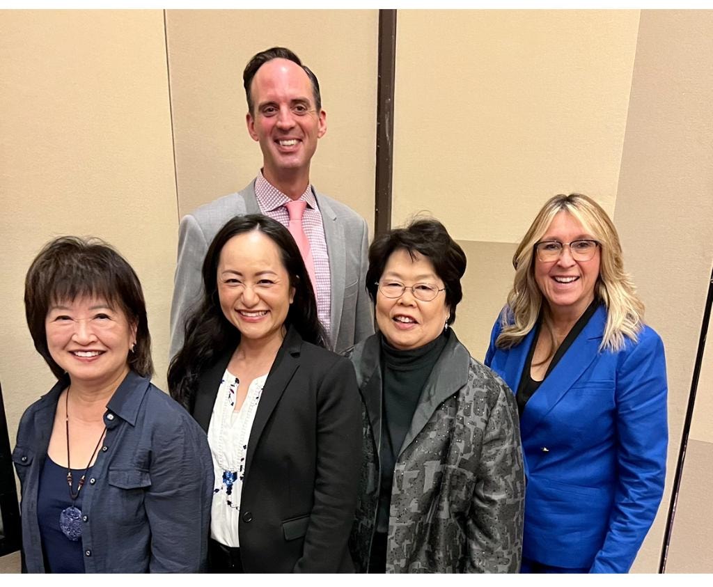 Sue Chan with board members