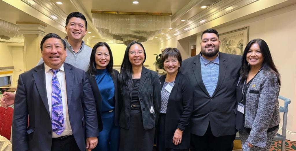 Sue Chan with colleagues at a community event