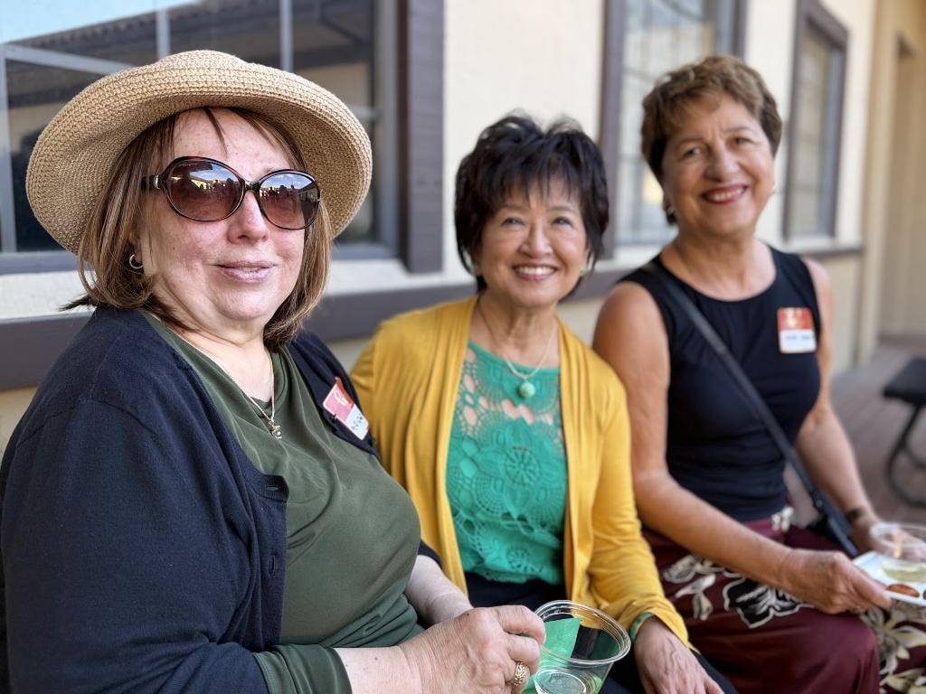 Sue Chan with supporters at outdoor gathering