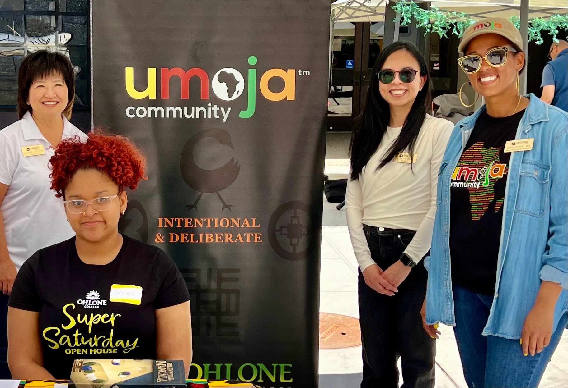 Umoja community event staff posing together